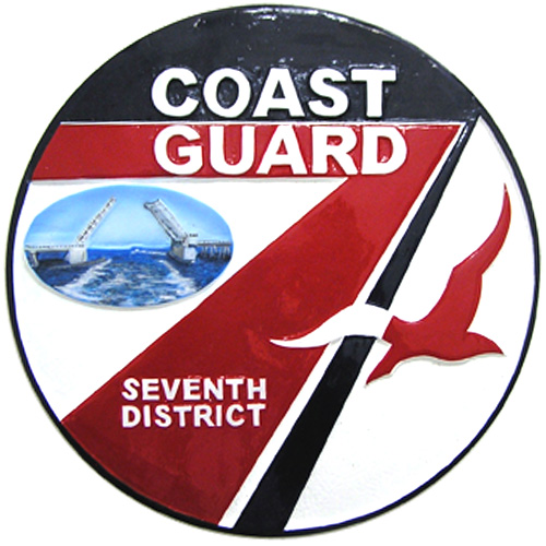 Coast Guard commemorative plaque on mahogany
